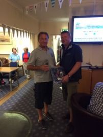 Paul presents the keelboat trophy to Mike Harrison, Musical Express